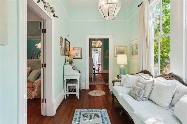 4501 Canal St, New Orleans, LA 70119 - living area with a chandelier, dark wood-type flooring, and plenty of natural light
