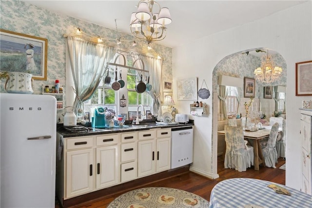 4501 Canal St, New Orleans, LA 70119 - bar featuring a chandelier, dishwasher, fridge, dark wood finished floors, and wallpapered walls