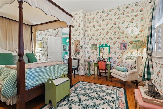 4501 Canal St, New Orleans, LA 70119 - bedroom featuring wallpapered walls and wood finished floors