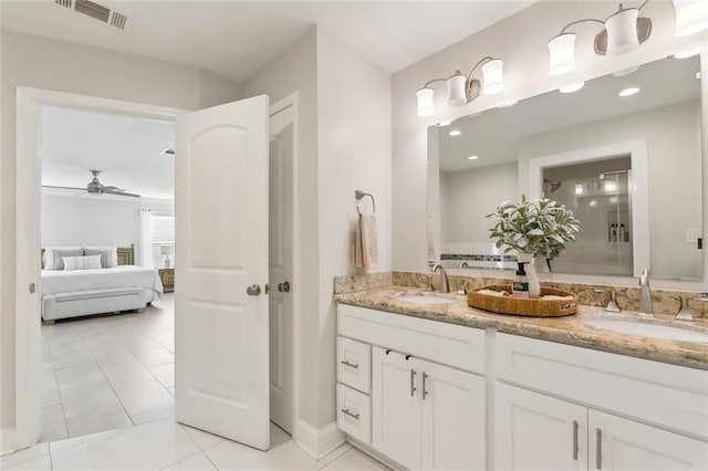 4009 Purdue Dr, Metairie, LA 70003 - ensuite bathroom with double vanity, a ceiling fan, baseboards, tile patterned floors, and a shower