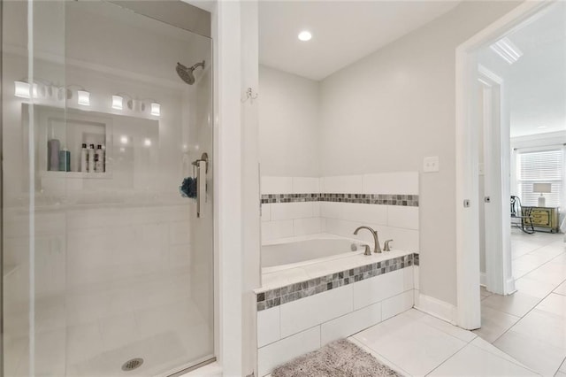 4009 Purdue Dr, Metairie, LA 70003 - bathroom with a shower stall, a bath, tile patterned flooring, and baseboards