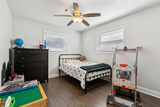 4009 Purdue Dr, Metairie, LA 70003 - bedroom with multiple windows, wood finished floors, baseboards, and ceiling fan