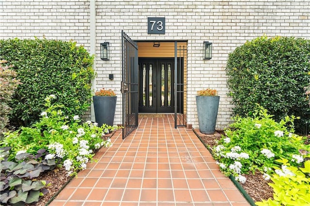 73 Doescher Dr, Harahan, LA 70123 - doorway to property featuring french doors and brick siding