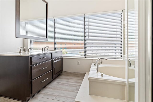 73 Doescher Dr, Harahan, LA 70123 - bathroom with double vanity and a bath