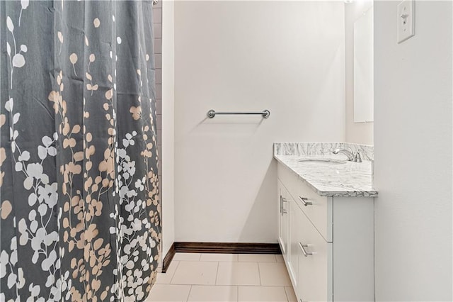 73 Doescher Dr, Harahan, LA 70123 - full bath with vanity, baseboards, tile patterned flooring, and curtained shower