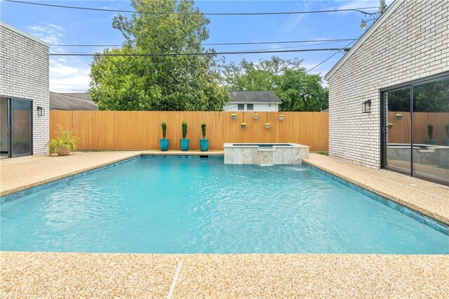 73 Doescher Dr, Harahan, LA 70123 - view of pool with a fenced backyard, a pool with connected hot tub, and a patio