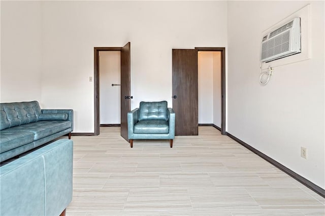 73 Doescher Dr, Harahan, LA 70123 - living room featuring a wall mounted air conditioner and baseboards