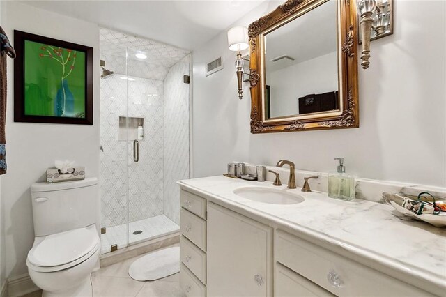 105 Mulberry Dr, Metairie, LA 70005 - bathroom with toilet, vanity, a stall shower, and tile patterned floors