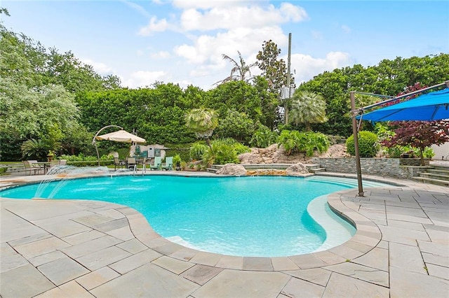105 Mulberry Dr, Metairie, LA 70005 - swimming pool featuring a patio area and view of scattered trees
