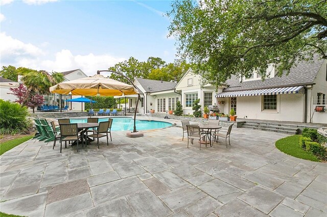 105 Mulberry Dr, Metairie, LA 70005 - outdoor pool with outdoor dining space, a patio, and french doors