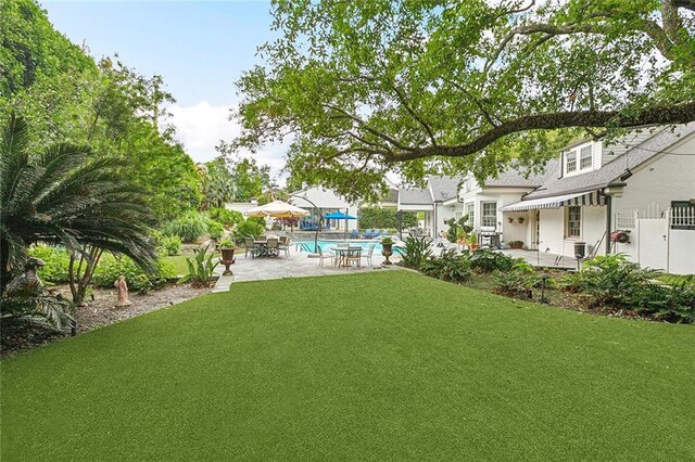 105 Mulberry Dr, Metairie, LA 70005 - view of grassy yard with a patio and an outdoor pool