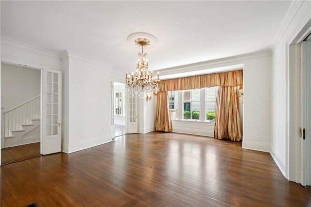 1923 State St, New Orleans, LA 70118 - empty room with a chandelier, wood finished floors, stairway, ornamental molding, and baseboards