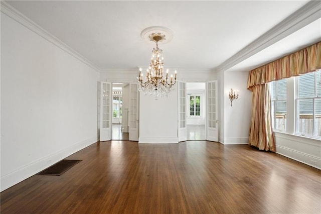 1923 State St, New Orleans, LA 70118 - empty room featuring a chandelier, dark wood-type flooring, ornamental molding, and baseboards