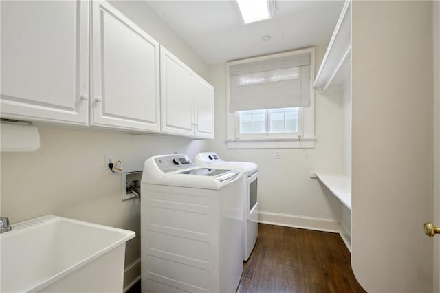 1923 State St, New Orleans, LA 70118 - laundry room with cabinet space, dark wood finished floors, separate washer and dryer, and baseboards