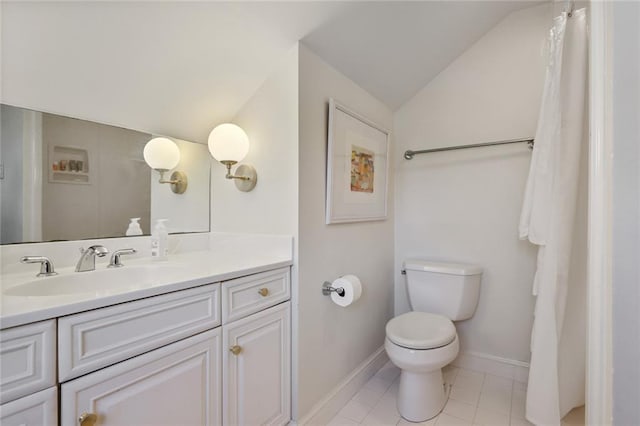 1923 State St, New Orleans, LA 70118 - bathroom with vaulted ceiling, toilet, baseboards, vanity, and tile patterned flooring