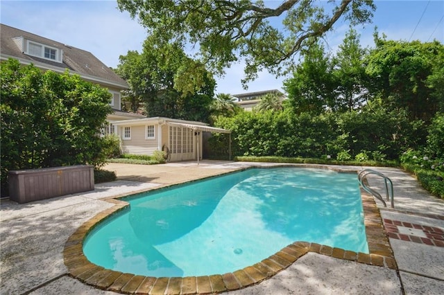 1923 State St, New Orleans, LA 70118 - swimming pool featuring a patio area, an outbuilding, and an exterior structure