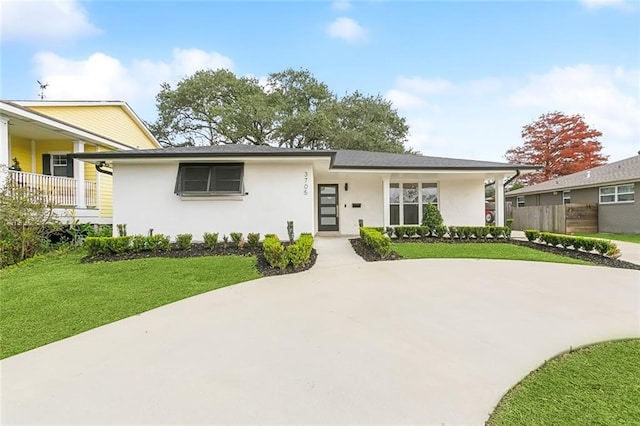 3705 James Dr, Metairie, LA 70003 - view of front of property featuring stucco siding and a front yard