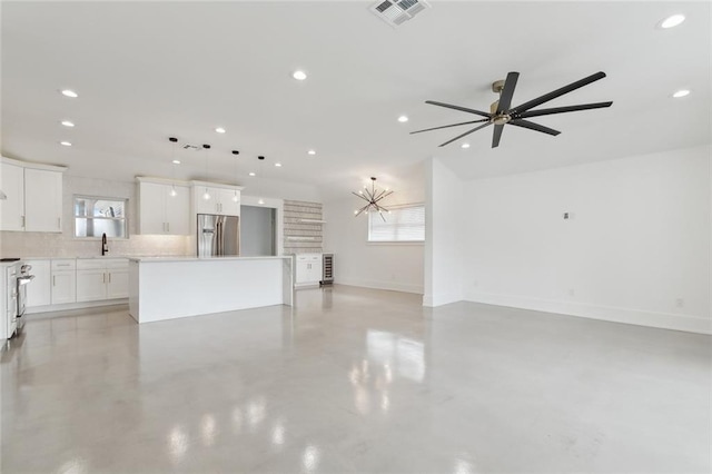 3705 James Dr, Metairie, LA 70003 - unfurnished living room with a sink, recessed lighting, baseboards, ceiling fan, and finished concrete floors