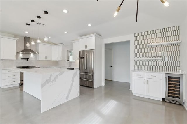 3705 James Dr, Metairie, LA 70003 - kitchen with beverage cooler, wall chimney exhaust hood, appliances with stainless steel finishes, white cabinetry, and a center island