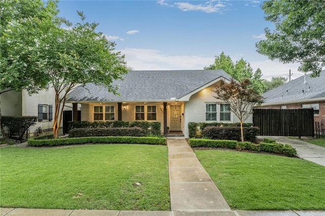 5844 Fleur De Lis Dr, New Orleans, LA 70124 - view of front facade featuring brick siding and a shingled roof