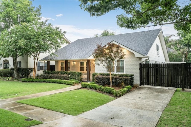 5844 Fleur De Lis Dr, New Orleans, LA 70124 - view of front of property featuring brick siding, roof with shingles, and driveway