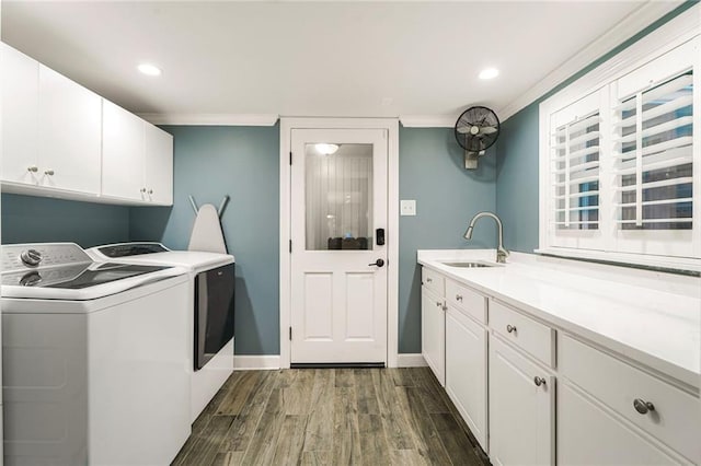 5844 Fleur De Lis Dr, New Orleans, LA 70124 - laundry room with washer and dryer, cabinet space, dark wood-style flooring, crown molding, and baseboards