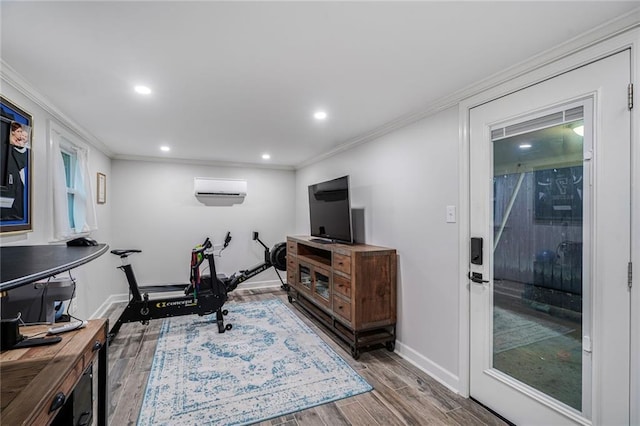 5844 Fleur De Lis Dr, New Orleans, LA 70124 - exercise room with crown molding, wood finished floors, baseboards, recessed lighting, and a wall unit AC