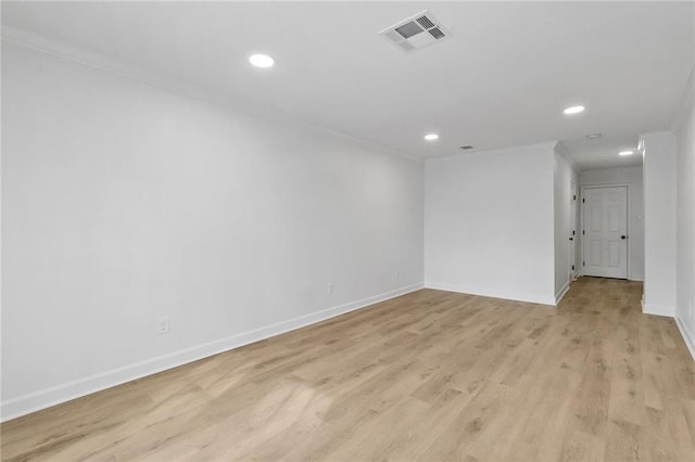1705 Haring Rd, Metairie, LA 70001 - empty room featuring ornamental molding, light wood-style floors, baseboards, and recessed lighting