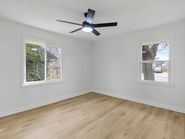 1705 Haring Rd, Metairie, LA 70001 - unfurnished room featuring healthy amount of natural light, light wood finished floors, and baseboards
