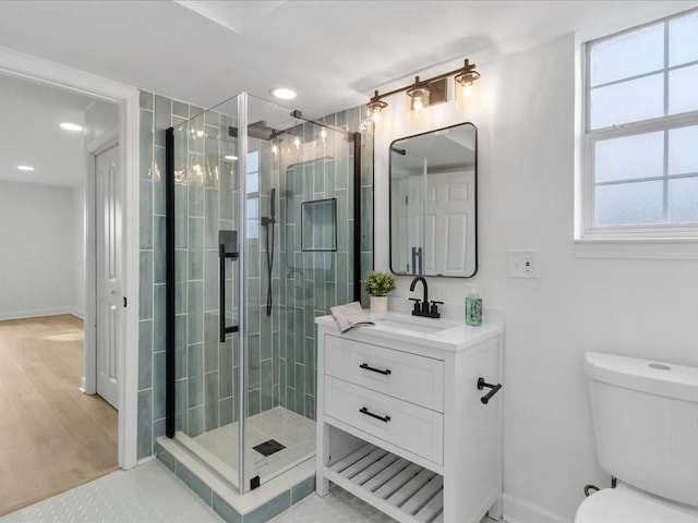 1705 Haring Rd, Metairie, LA 70001 - bathroom with vanity, a shower stall, toilet, baseboards, and recessed lighting