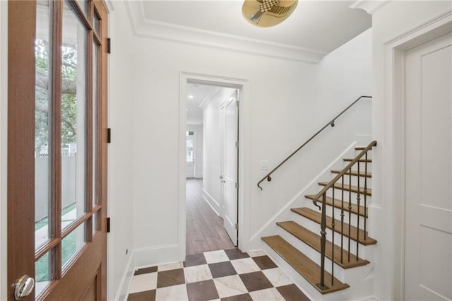 1015 Cadiz St, New Orleans, LA 70115 - entrance foyer featuring plenty of natural light, baseboards, crown molding, stairs, and tile patterned floors