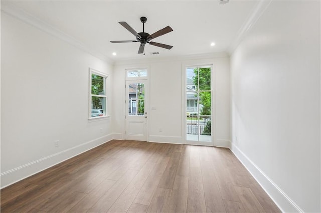 1015 Cadiz St, New Orleans, LA 70115 - unfurnished room featuring ornamental molding, wood finished floors, a ceiling fan, baseboards, and recessed lighting