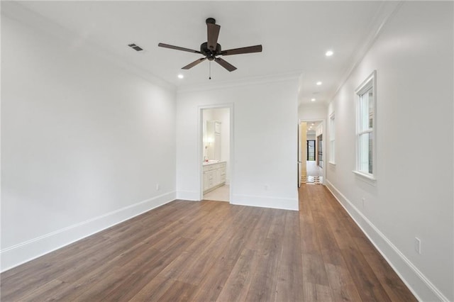 1015 Cadiz St, New Orleans, LA 70115 - unfurnished bedroom featuring wood finished floors, ornamental molding, baseboards, recessed lighting, and ensuite bath