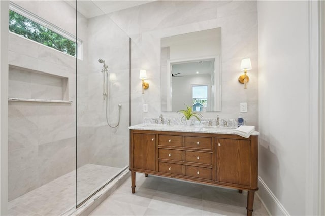 1015 Cadiz St, New Orleans, LA 70115 - bathroom with walk in shower, double vanity, and plenty of natural light