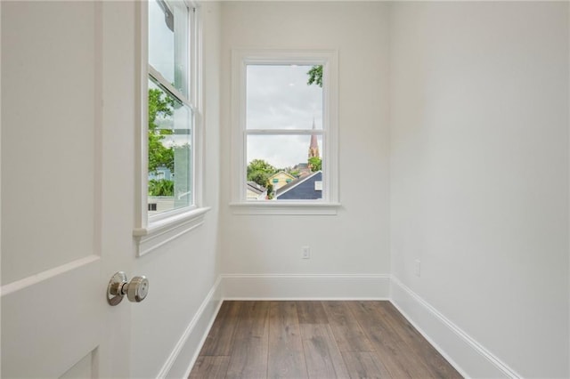 1015 Cadiz St, New Orleans, LA 70115 - unfurnished room with dark wood-style floors and baseboards