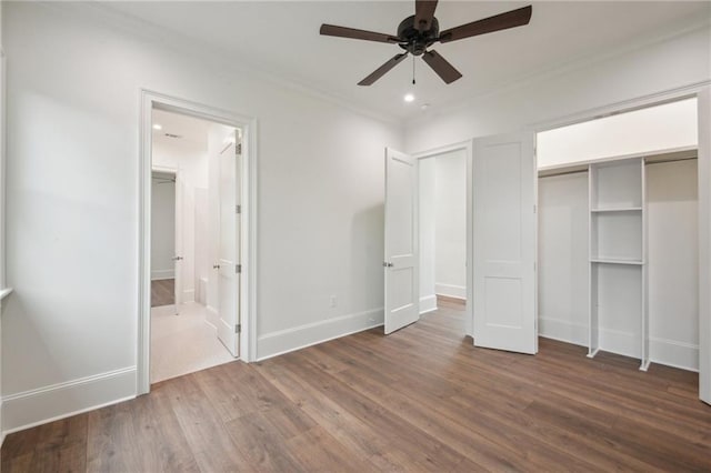 1015 Cadiz St, New Orleans, LA 70115 - unfurnished bedroom with ornamental molding, wood finished floors, baseboards, connected bathroom, and recessed lighting