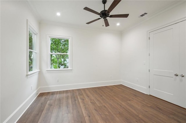 1015 Cadiz St, New Orleans, LA 70115 - empty room featuring ornamental molding, a ceiling fan, baseboards, dark wood finished floors, and recessed lighting