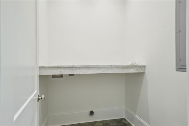 1015 Cadiz St, New Orleans, LA 70115 - laundry room featuring electric dryer hookup, washer hookup, and baseboards