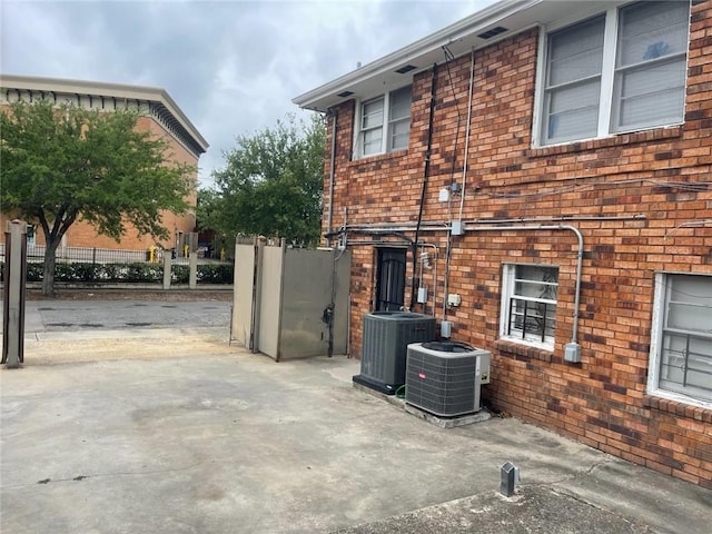 3218 Gentilly Blvd, New Orleans, LA 70122 - view of property exterior with central AC and brick siding