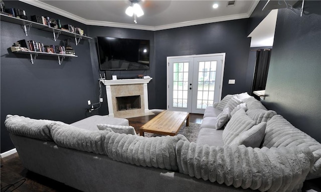1613 Live Oak St, Slidell, LA 70460 - living room featuring a ceiling fan, wood finished floors, crown molding, french doors, and a high end fireplace