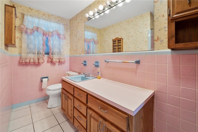 564 Saint Ann St, Marrero, LA 70072 - full bathroom with wallpapered walls, tile patterned flooring, vanity, toilet, and a wainscoted wall