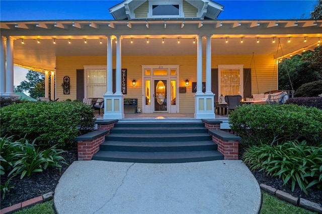 215 N 6th St, Ponchatoula, LA 70454 - doorway to property featuring covered porch