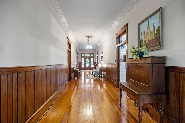 215 N 6th St, Ponchatoula, LA 70454 - hall with wainscoting, hardwood / wood-style flooring, crown molding, and wood walls