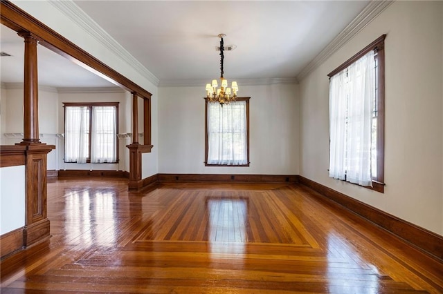 215 N 6th St, Ponchatoula, LA 70454 - spare room with a chandelier, baseboards, ornamental molding, and decorative columns