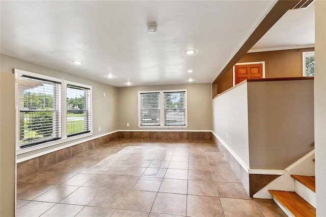 4959 Elysian Fields Ave, New Orleans, LA 70122 - spare room featuring light tile patterned flooring, recessed lighting, a smoke detector, and stairway