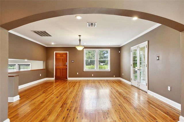 4959 Elysian Fields Ave, New Orleans, LA 70122 - unfurnished room featuring light wood-style flooring, ornamental molding, arched walkways, baseboards, and recessed lighting
