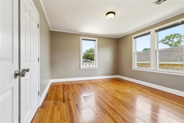 4959 Elysian Fields Ave, New Orleans, LA 70122 - spare room with plenty of natural light, light wood finished floors, baseboards, and ornamental molding