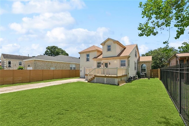 4959 Elysian Fields Ave, New Orleans, LA 70122 - back of house featuring a deck and driveway