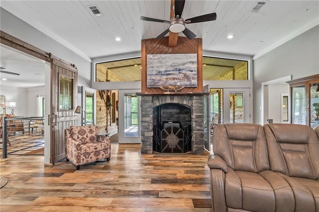 18064 Faller Rd, Tickfaw, LA 70466 - living room with ceiling fan, wood finished floors, recessed lighting, a fireplace, and wood ceiling