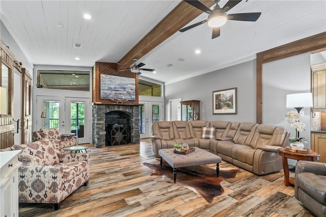 18064 Faller Rd, Tickfaw, LA 70466 - living area featuring light wood finished floors, ceiling fan, beam ceiling, recessed lighting, and a stone fireplace